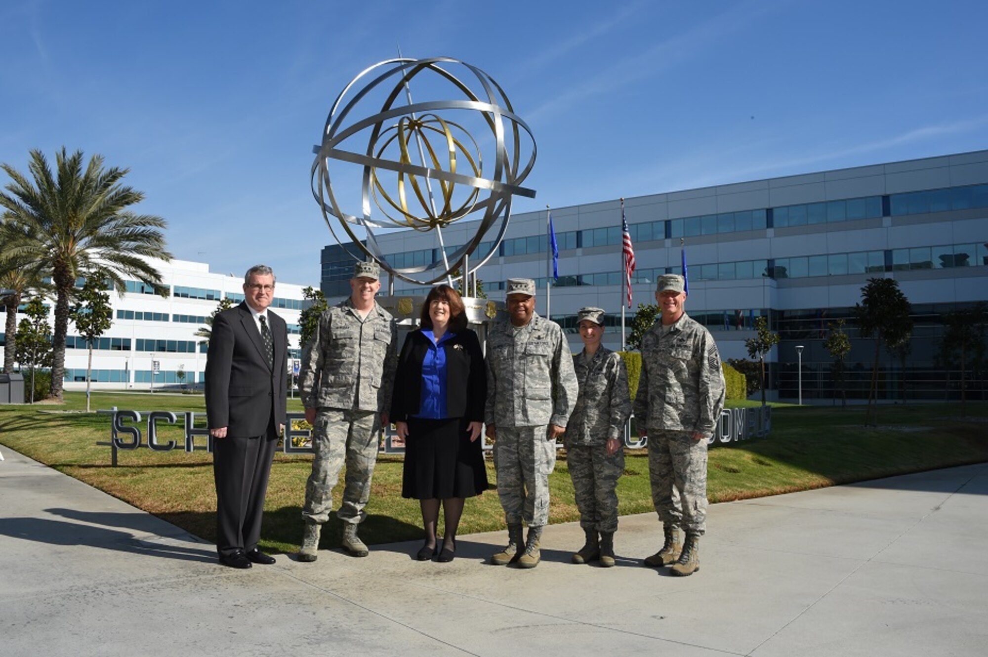 The Honorable Suzanne Fuentes (center), Mayor of El Segundo, Calif., stands for a group photo with the Space and Missile Systems Center and 61st Air Base Group leadership in front of the Armillary Sphere -- aka the Space Motif -- a landmark within SMC's Schriever Space Complex at Los Angeles Air Force Base. The mayor is joined by (left to right) Tom Fitzgerald, acting SMC executive director, Maj. Gen. Robert McMurry, SMC vice commander, Lt. Gen. Samuel Greaves, SMC commander and Air Force program executive officer for space, Col. Donna Turner, 61st ABG commander and Chief Master Sgt. Craig Hall, SMC command chief. The mayor’s visit Dec. 21, 2015 included an office call and SMC briefing. The Air Force and the city have a long-standing relationship of cooperation as Los Angeles AFB and SMC reside within the city limits of El Segundo. The meeting was an opportunity to strengthen that relationship and discuss emerging issues. (U. S. Air Force photo/Joseph Juarez, Sr.)