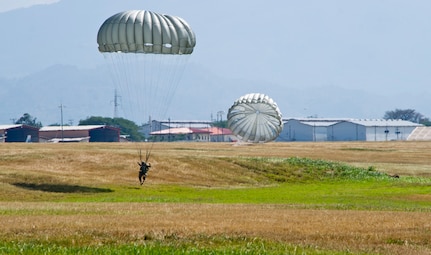A U.S. Army Soldier with Special Operations Command South (Forward) 7310 prepares to land during a static-line training jump Jan. 11, 2016 at Soto Cano Air Base, Honduras. The training jump gave the SOC FWD members a chance to remain current on their jump requirements, while also training with their Honduran counterparts. (U.S. Air Force photo by Capt. Christopher Mesnard/Released)