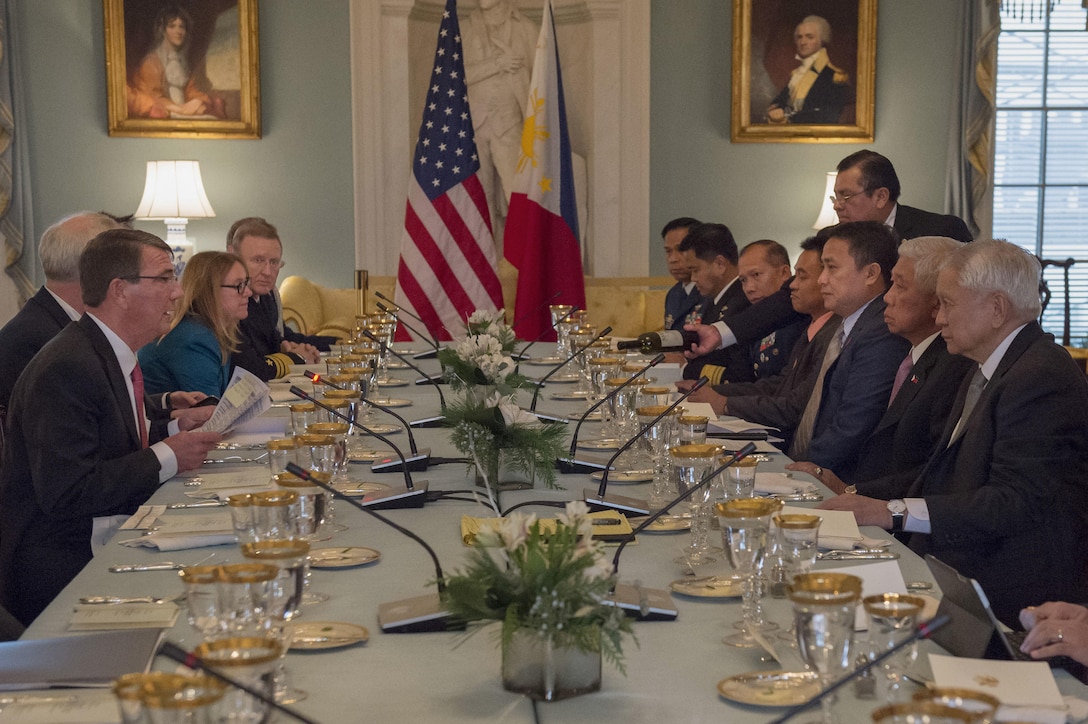 Defense Secretary Ash Carter speaks with Philippine Foreign Secretary Albert del Rosario, right, and Philippine Defense Secretary Voltaire Gazmin, second from right, during a working lunch at the State Department, Jan. 12, 2016. The leaders met to discuss matters of mutual importance. DoD photo by Air Force Senior Master Sgt. Adrian Cadiz