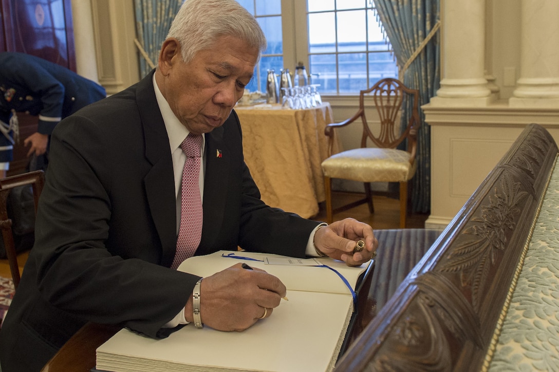 Philippine Defense Secretary Voltaire Gazmin signs a guest book as he arrives at the State Department to meet with Secretary of State John Kerry and Defense Secretary Ash Carter, Jan. 12, 2016. The leaders met to discuss matters of mutual importance. DoD photo by Air Force Senior Master Sgt. Adrian Cadiz