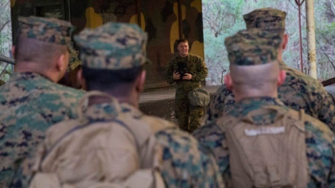 Sgt. Caleb Renner, the chief chemical, biological, radiological, and nuclear instructor with II Marine Headquarters Group, gives an hour-long class on how to properly wear and function in a M50 gas mask at Marine Corps Base Camp Lejeune, N.C., Jan. 8, 2016. The chamber is a routine exercise to ensure the durability of each Marines gear while exposed to chlorobenzylidene malononitrile, or CS gas, which is a bi-annual qualification requirement for Marines.