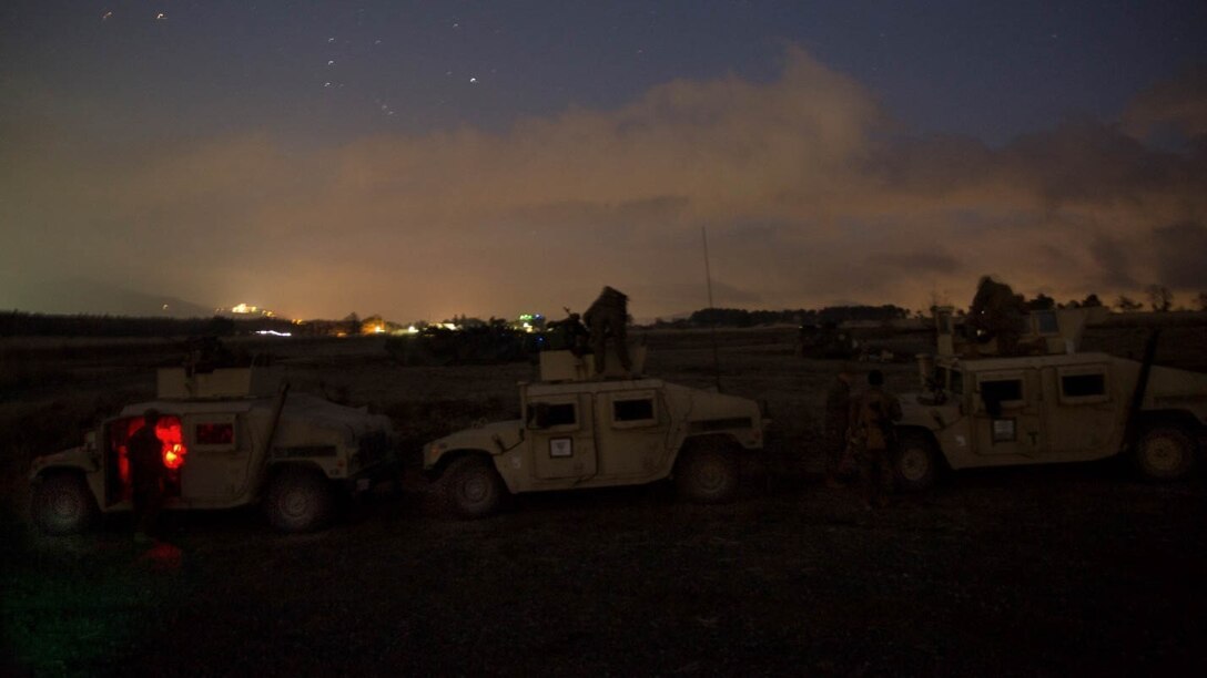 COMBINED ARMS TRAINING CENTER, GOTEMBA, Japan — Marines mount Humvees in preparation for a night live-fire training event during Exercise Fuji Samurai at Combined Arms Training Center Camp Fuji, Gotemba, Japan,  Jan. 7,2016. Exercise Fuji Samurai builds interoperability between multiple combat elements through live fire and offensive tactics training. During the training, Marines with Lima Co. 3rd Battalion 5th Marine Regiment, 1st Marine Division, I Marine Expeditionary Force and 1st Battalion 10th Marine Regiment, 2nd Marine Division, II Marine Expeditionary Force participated in combined arms training firing weapons systems such as mortars, the M2 .50 caliber machine gun and the FGM-148 Javelin missile.