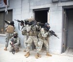 New York Army National Guard Soldiers assigned to Company A, 1st Battalion 69th Infantry, prepare to conduct room-clearing training at the New York Police Department's urban training facility at Rodman's Neck in The Bronx, on Jan. 9, 2016. 