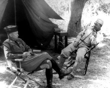 Col. Dwight Eisenhower, IX Army Corps Chief of Staff, discussing operations with Lt. Col. James Bradley, 4th Army Chief of Staff, at Hunter Liggett Military Reservation on June 10, 1941.