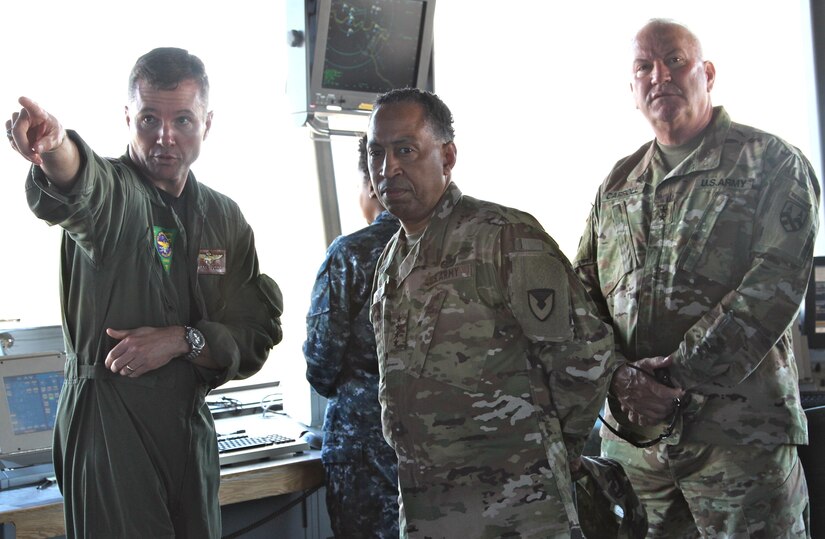 The Commander of the 377th Theater Sustainment Command, Maj. Gen. Les Carroll (right), hosted the Commander of the U.S. Army Materiel Command, Gen. Dennis Via (center) during a command visit to Naval Air Station Joint Reserve Base New Orleans Jan. 8. During the visit, Gen. Via received a base overview by NAS JRB Commander, Navy Capt. Mark Sucato (left). The 377th TSC serves as the largest two-star command in the Army Reserve with a mission to operate as the Senior Army Logistics headquarters capable of planning, controlling and synchronizing operational-level Army deployment and sustainment.