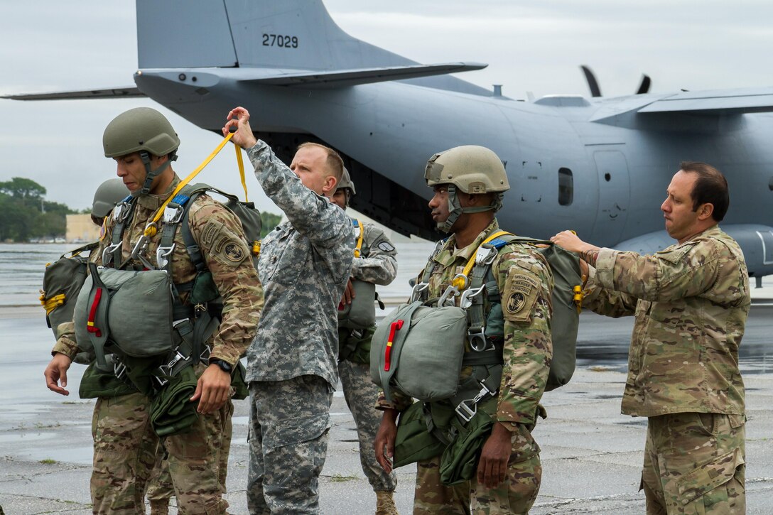 Army jumpmasters conduct parachute and equipment inspections  before an airborne operation over Homestead Air Reserve Base, Fla., Jan. 12, 2016. The soldiers are assigned to Special Operations Command South. U.S. Army photo by Staff Sgt. Osvaldo Equite
