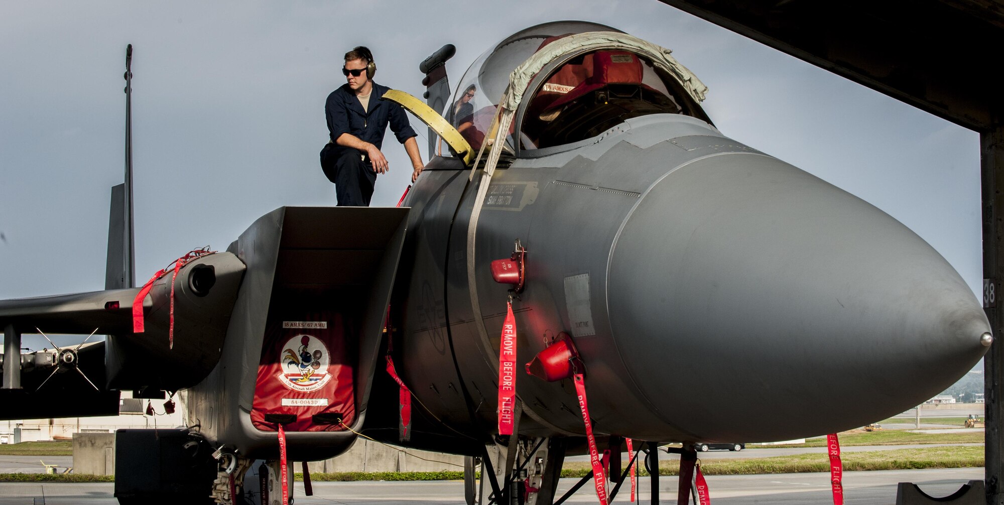 Airman 1st Class Justin Wanke, a 67th Air Maintenance Unit electricity and environmental specialist, helps conduct a cabin pressure test on an F-15E Strike Eagle, Jan. 8, 2016, on the flightline at Kadena Air Base, Japan. Cabin pressure tests are conducted to prevent hypoxia, a lack of oxygen reaching muscle tissue, from occurring in pilots. (U.S. Air Force photo/Airman 1st Class Nick Emerick)