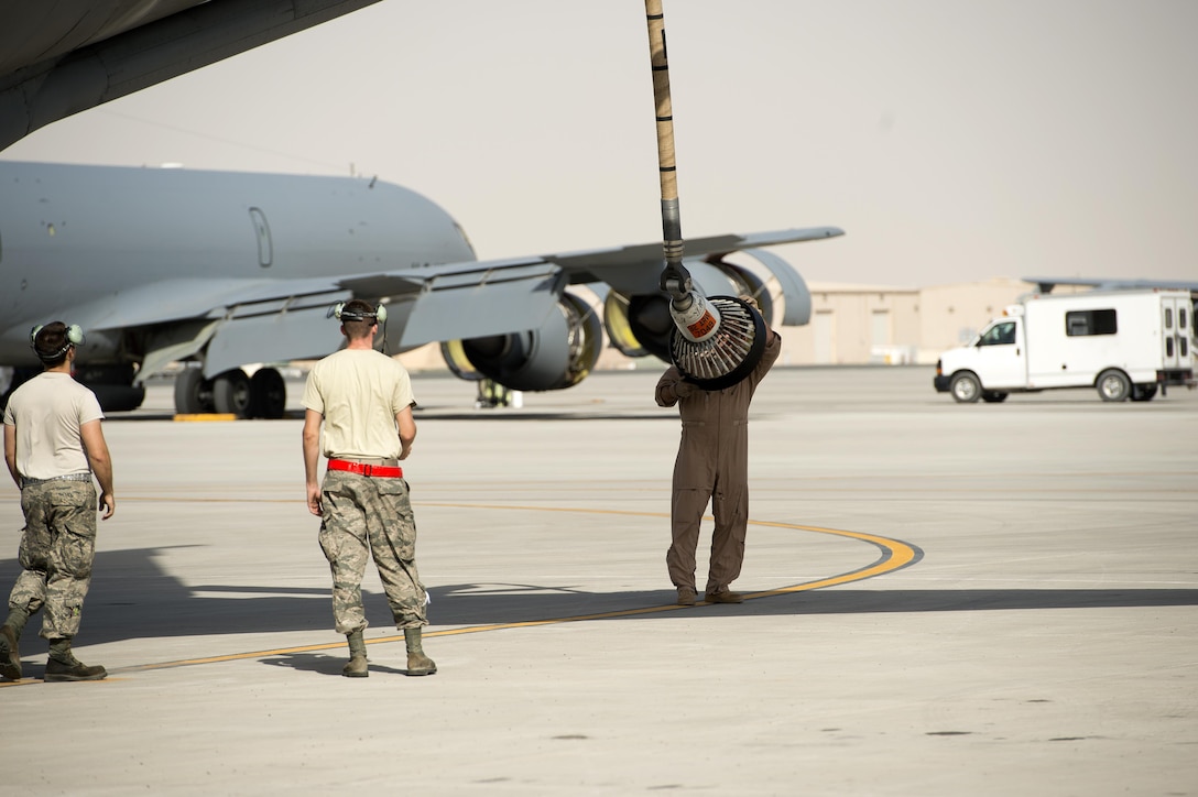 U.S. Air Force airmen inspect the drogue adaptor on a KC-135 Stratotanker before takeoff at Al Udeid Air Base, Qatar, in support of Operation Inherent Resolve, Jan. 8, 2016. The airmen are assigned to the 340th Expeditionary Air Refueling Squadron. The operation is part of the coalition's counter-ISIL efforts. U.S. Air Force photo by Tech. Sgt. Nathan Lipscomb