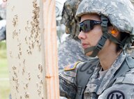 Staff Sgt. Tasha D. Seise, a human resources noncommissioned officer for United States Army Reserve Pacific Command Support Unit, examines her target during an M16 qualification range at Range CR2 on Schofield Barracks Jan. 9, 2016. This was Seise’s first opportunity to participate in a live fire range with USAPAC-SU since transferring to the unit in June.
