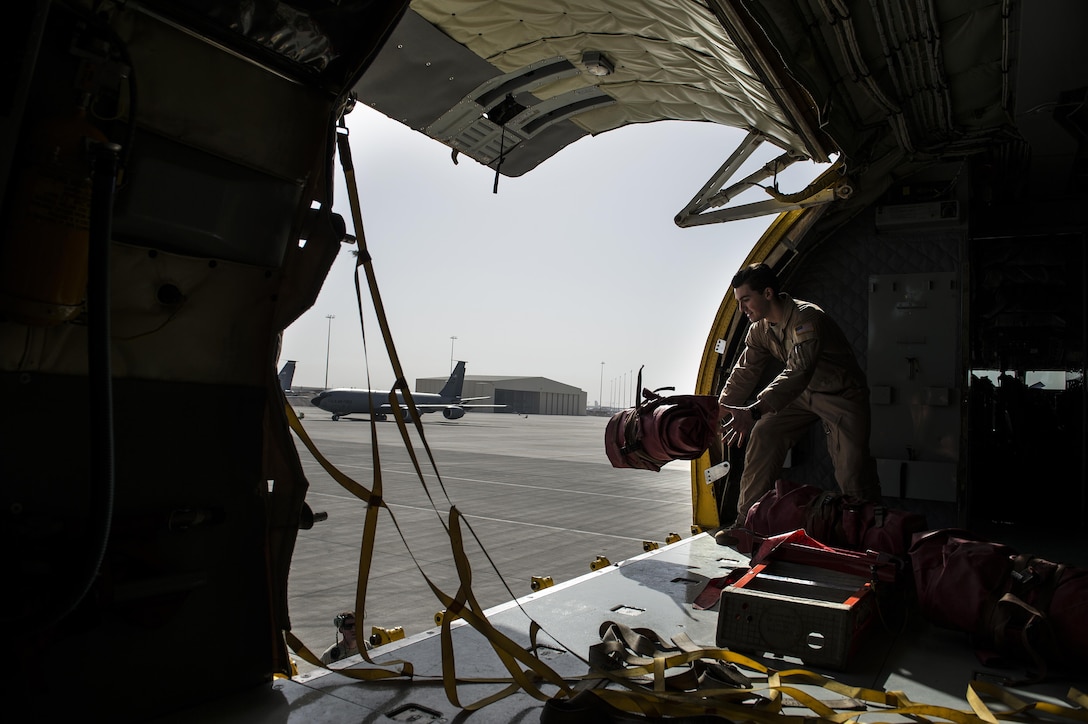 U.S. Air Force Senior Airman Timothy Weber loads equipment onto a KC-135 Stratotanker at Al Udeid Air Base, Qatar, in support of Operation Inherent Resolve, Jan. 8, 2016. Weber is a boom operator assigned to the 340th Expeditionary Air Refueling Squadron. U.S. Air Force photo by Tech. Sgt. Nathan Lipscomb
