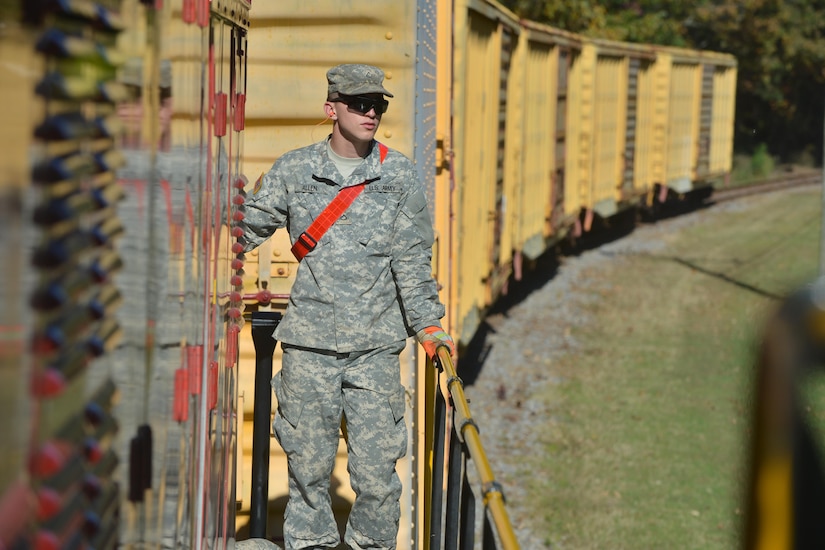 U.S. Army Reserve Pfc. Edward Allen, a railway operations student with the Maritime Intermodal Training Department, surveys the area for hazards at Fort Eustis, Va., Oct. 23, 2015. Along with looking out for hazards, the students also learned rail safety procedures. (U.S. Air Force photo by Staff Sgt. Natasha Stannard)