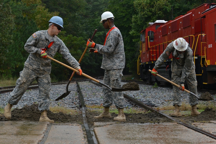 U.S. Army Reserve students repair railway tracks as part of the railway operations course at Fort Eustis, Va., Oct. 16, 2015. The railway students learned how to repair various parts of the train and tracks, along with operating and conducting. (U.S. Air Force photo by Staff Sgt. Natasha Stannard)
