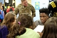 Team East defensive back Trayvon Mullen (right), Coconut Creek High School in Coconut Creek, Fla., and Sgt. 1st Class Andrew Fink, the 2016 Army Noncommissioned Officer of the Year, try to stump the students during a math game Tuesday, Jan. 5 at Boysville in San Antonio, Texas. Soldiers and the nation’s top high school football players are visiting locations like Boysville, a program for children from abused and neglected homes, as part a way to give back to the community leading up to the 2016 Army All-American Bowl, which takes place Saturday, Jan. 9 at the Alamo Bowl in downtown San Antonio. (U.S. Army photo by Sgt. Brandon Hubbard, 204th Public Affairs Detachment/Released)