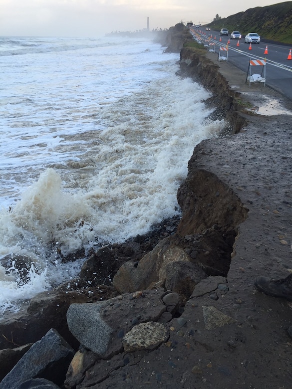 Winter storms and high tide combine their energy to force water up against the Pacific Coast Highway, in Carlsbad. The Corps of Engineers authorized the emergency placement of protective stone to prevent further damage.