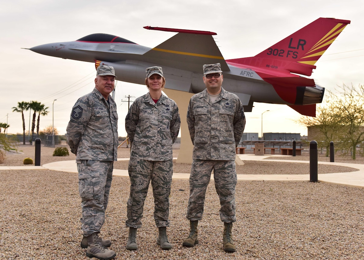 Senior Master Sgt. Stephen Brook, 944th Logistics Readiness Squadron transportation manager, Chief Master Sgt. Rhonda Hutson, 944th Fighter Wing command chief, and Senior Master Sgt. Patrick Mahan, 944th Logistics Readiness Squadron fuels superintendent, pose for a photo Jan 10 after telling what they remember seeing during Operation Desert Storm early in their military careers. (U.S. Air Force photo/Staff Sgt. Nestor Cruz)
