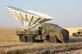 A 5-ton vehicle carrying a 30-foot radar dish stands ready at Saylor Creek Range Complex, Idaho. Contract range personnel modified the vehicle to create a target capable of being relocated for different mission needs. (Courtesy photo)
