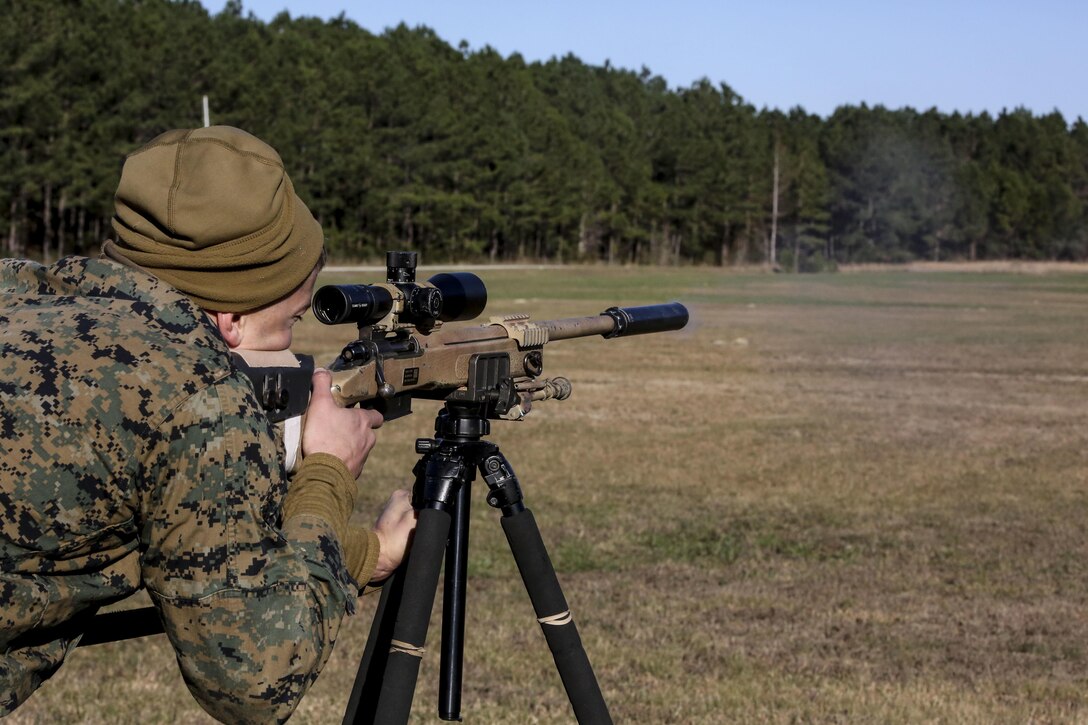 Lance Cpl. Richard K. Wiebe, a student undergoing the 2nd Marine Division Combat Skills Center Pre-Scout Sniper Course, fires on a target with the M40A5 sniper rifle at Camp Lejeune, N.C., Jan. 12, 2016. Students worked in teams of two, executing roles as a spotter or a shooter, to engage targets between 300 and 1,000 meters away. (U.S. Marine Corps photo by Cpl. Paul S. Martinez/Released)