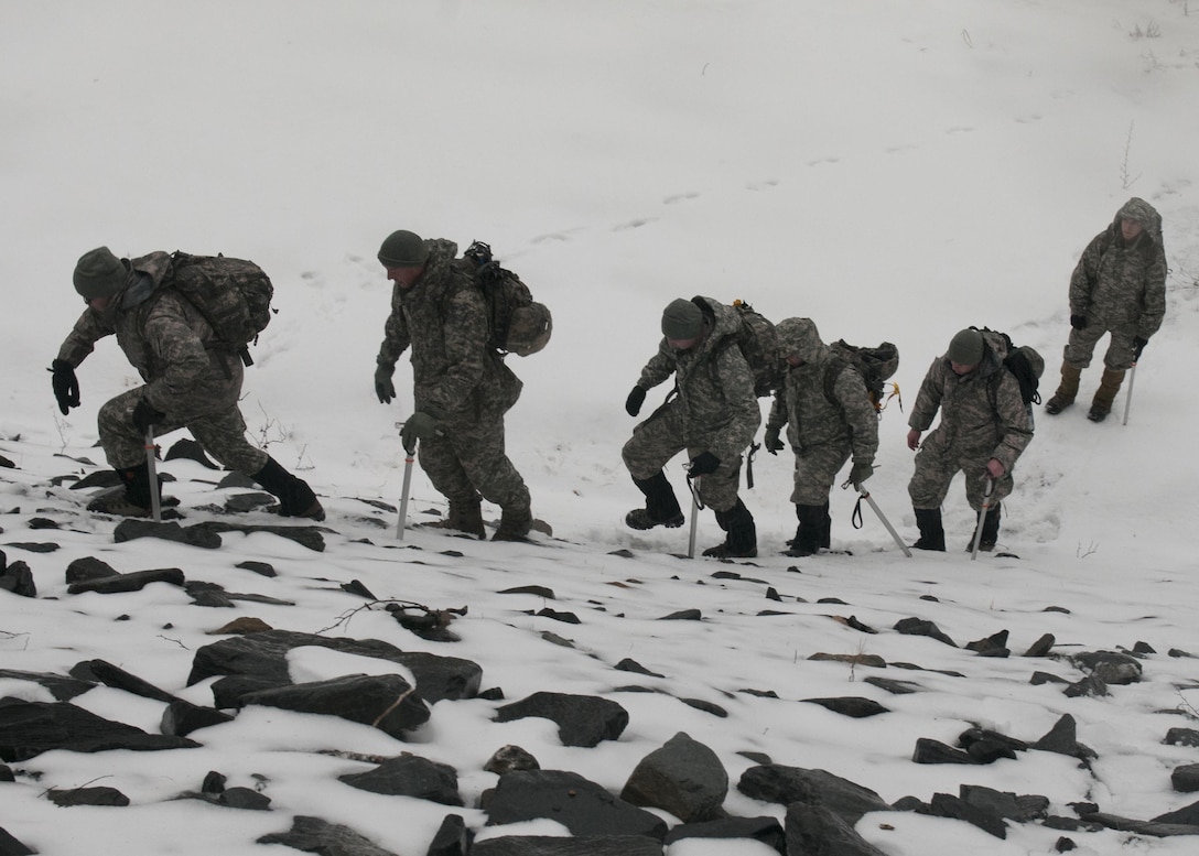 Soldiers participate in steep snow traverse training at Camp Ethan Allen Training Site in Jericho, Vt., Jan. 10, 2016. The soldiers are members of the Vermont National Guard. Vermont Army National Guard photo by Spc. Avery Cunningham