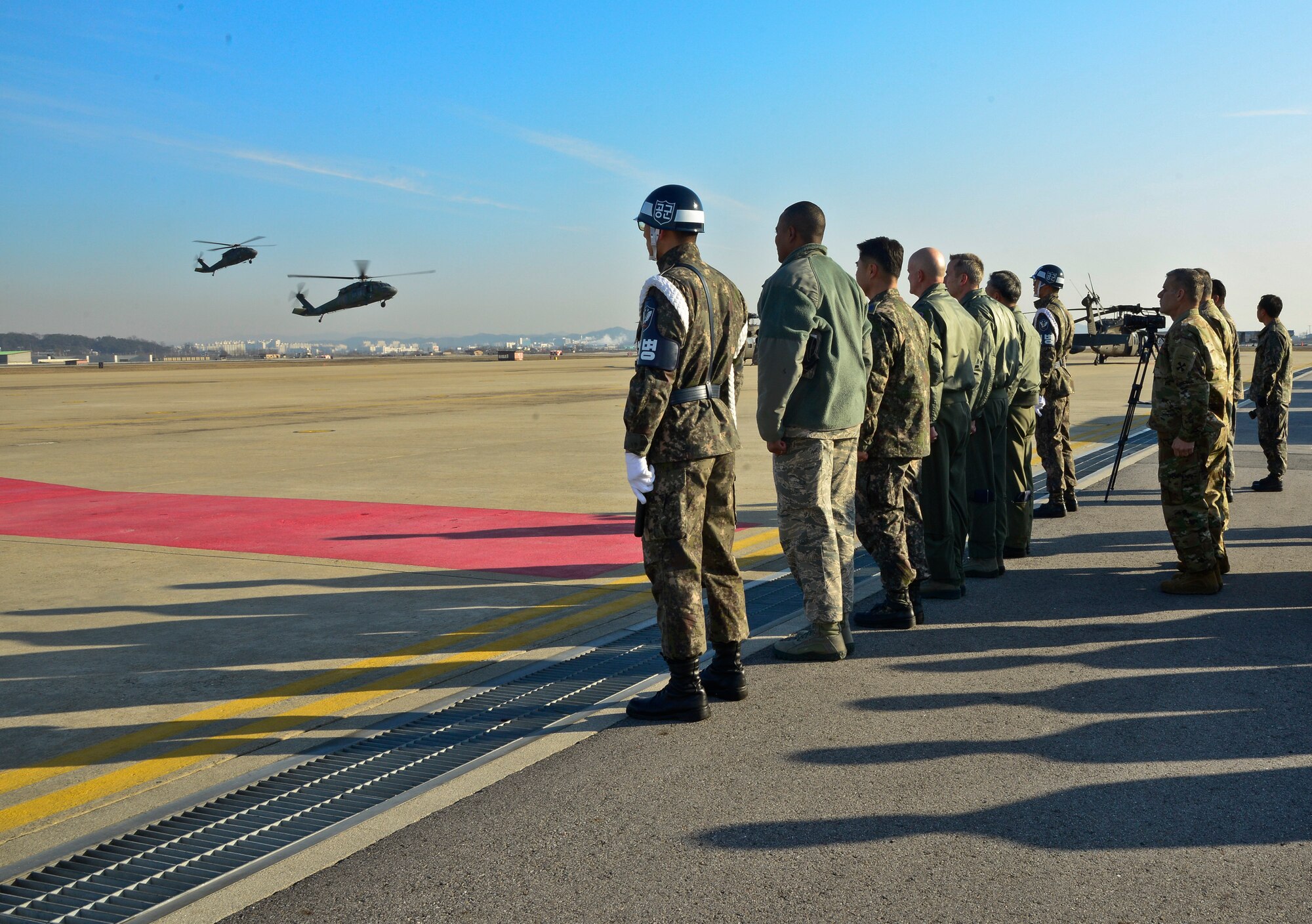 U.S. Forces Korea, 7th Air Force and 51st Fighter Wing leadership await the arrival of Gen. Lee, Sun-Jin, Chairman of the Republic of Korea Joint Chiefs of Staff and Joint Defense Headquarters chief director, at Osan Air Base, ROK, Jan. 11, 2016. During his visit, Lee had the opportunity to visit various locations across the base including an orientation at the Korean Air Operations Center and a static display featuring the 25th and 36th Fighter Squadrons at the weapons load training facility to discuss A-10 Warthog and F-16 Fighting Falcon capabilities and weapons systems. (U.S. Air Force photo by Senior Airman Kristin High/Released)
