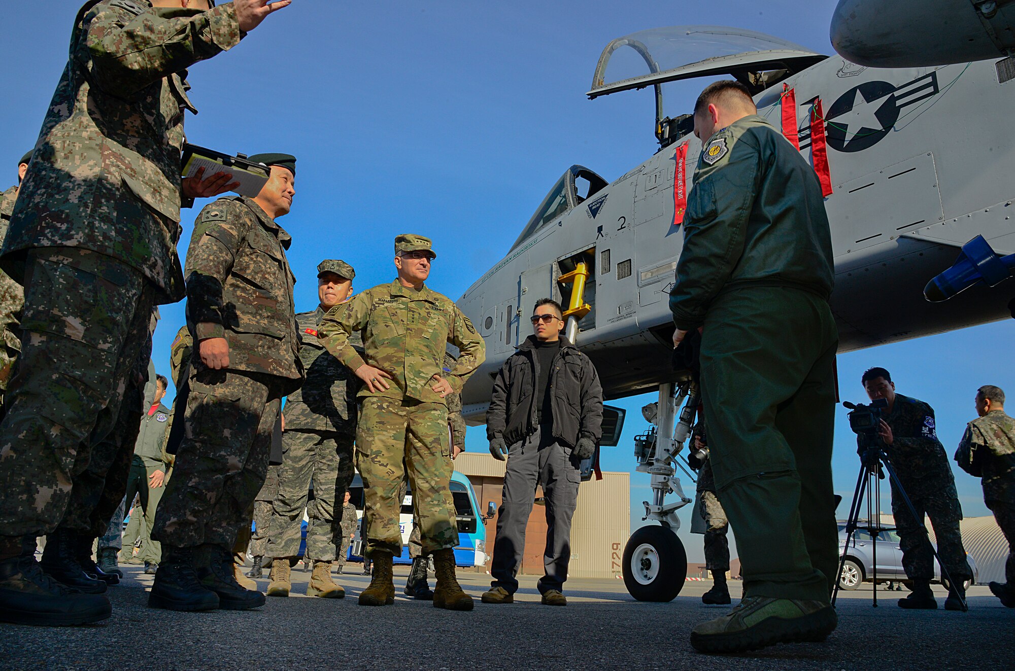 Gen. Lee, Sun-Jin, Chairman of the Republic of Korea Joint Chiefs of Staff and Joint Defense Headquarters chief director; and Gen. Curtis Scaparrotti, United Nations Command, ROK/US Combined Forces Command and U.S. Forces Korea commander, listens to Lt. Col Razvan Radoescu, 25th Fighter Squadron commander, brief during a recent visit on Osan Air Base, ROK, Jan. 11, 2016. Lee spoke to Radoescu and the 36th Fighter Squadron commander about fighter capabilities after recent provocative action by North Korea.(U.S. Air Force photo by Senior Airman Kristin High/Released)
