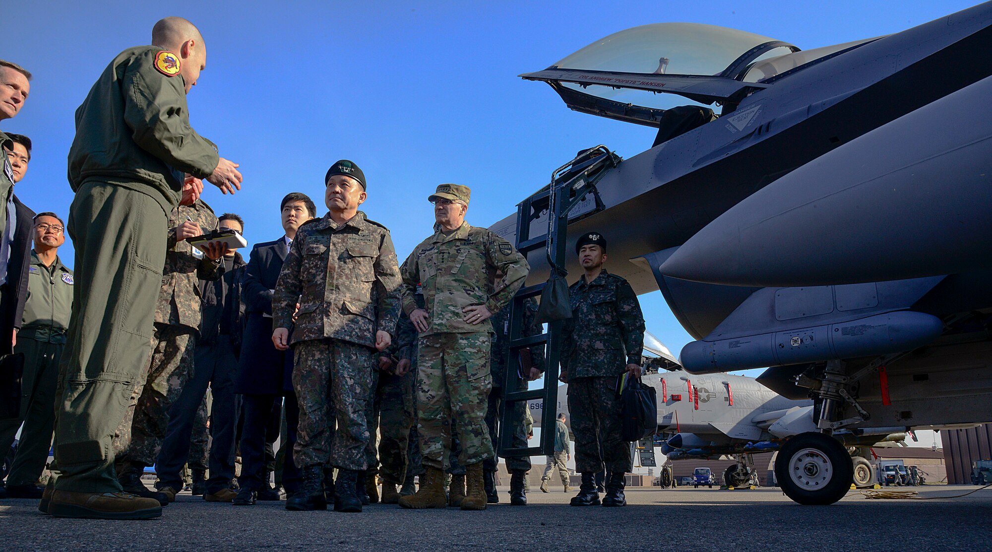 Lt. Col. Nicholas Evans, 36th Fighter Squadron commander, briefs Gen. Lee, Sun-Jin, Chairman of the Republic of Korea Joint Chiefs of Staff and Joint Defense Headquarters chief director, during a recent visit to Osan Air Base, ROK, Jan. 11, 2016. Lee visited Team Osan to discuss the US/ROK alliance after recent provocative action by North Korea. He toured various facilities across the base and spoke with leadership, reinforcing the bond between the ROK and U.S.(U.S. Air Force photo by Senior Airman Kristin High/Released)