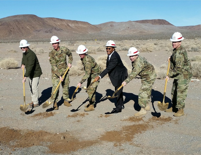 Officials toss ceremonial shovels of dirt for the new MQ-1C Gray Eagle UAS facility during a groundbreaking ceremony Jan. 12 at Fort Irwin, California. Pictured from left to right are: Todd Gillum, Cox Construction; Maj. Gen. Joseph Martin, commanding general, National Training Center and Fort Irwin; Col. Kirk Gibbs, commander, U.S. Army Corps of Engineers Los Angeles District; Marcus Watkins, director, NASA Management Office; Col. Matthew Ruedi, commander, 916th Support Brigade and Col. G. Scott Taylor, commander, U.S. Army Garrison Fort Irwin.