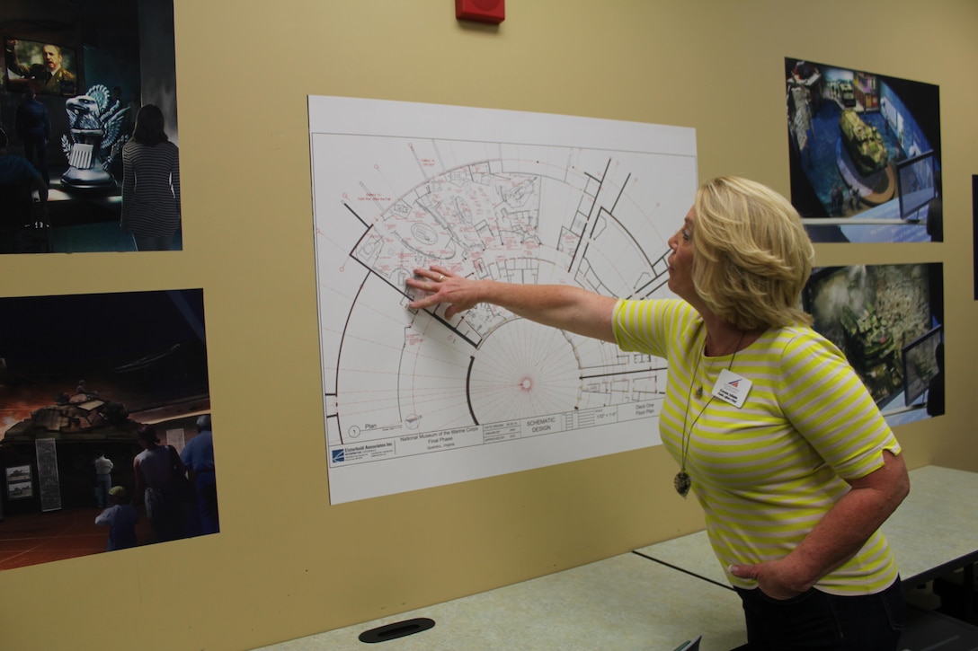 Gwenn Adams, public affairs chief for the National Museum of the Marine Corps, examines the blueprint for the museum’s final phase completion project in September 2015.
