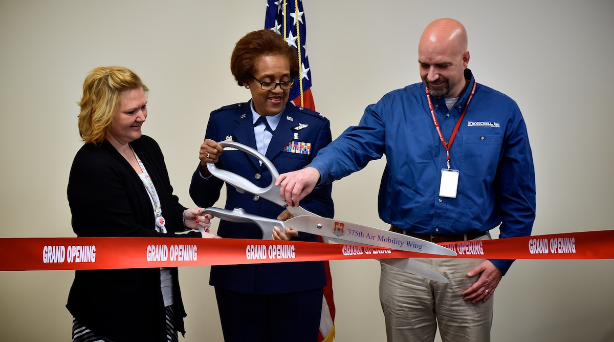 Col. Vanessa Mattox, 932nd Medical Group commander, is joined by Lacie Ebers from Kirlin Builders and Barry Klassy, executive vice president of Kroeschell Engineering, during a ribbon-cutting ceremony that was held Jan. 11, 2016, at the 932nd Aerospace Medicine Squadron's clinic. The new facility is located on the fourth floor of the hospital at Scott Air Force Base, Illinois. (U.S. Air Force photo by Christopher Parr) 