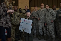 Air Commandos are reunited with family members and friends during Operation Homecoming at the Deployment Control Center on Hurlburt Field, Jan. 13, 2016. Operation Homecoming brought approximately 80 Airmen home from their deployment overseas.  (U.S. Air Force photo by Senior Airman Ryan Conroy) 