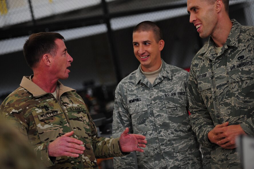 Command Sgt. Maj. William Thetford, U.S. Special Operations Command senior enlisted advisor, speaks with members assigned to the 727th Special Operations Aircraft Maintenance Squadron Jan. 7, 2016, during his visit to Cannon Air Force Base, N.M. The Air Commandos briefed Thetford about the maintenance of remotely piloted aircraft at Cannon. (U.S. Air Force photo/Tech. Sgt. Manuel Martinez)
