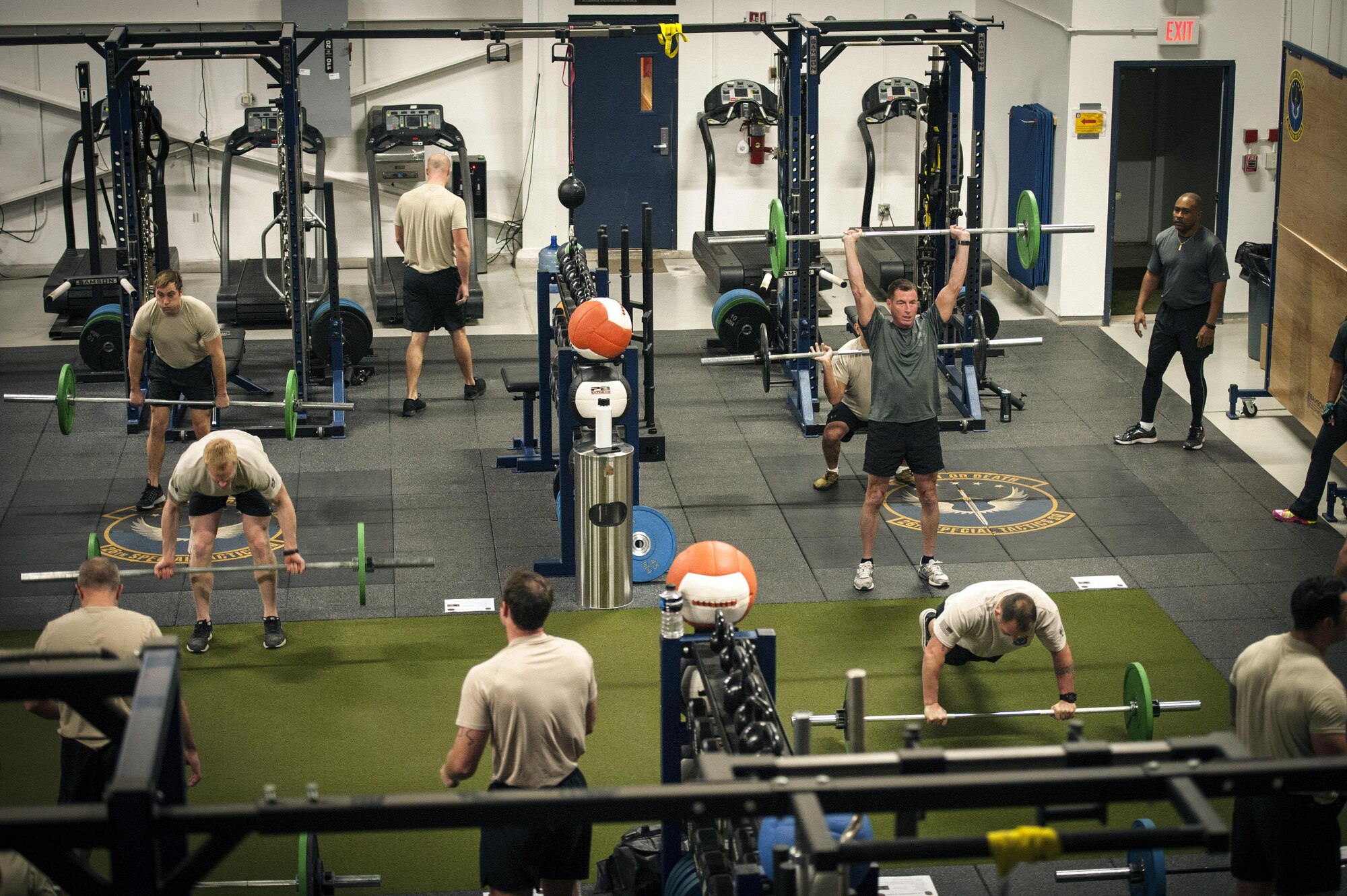 Command Sgt. Maj. William Thetford, U.S. Special Operations Command senior enlisted advisor, performs a workout session with members of 26th Special Tactics Squadron Jan. 7, 2016, during a visit to Cannon Air Force Base, N.M. Thetford affirmed to Air Commandos how crucial fitness is in maintaining the most important part of the mission - the people. (U.S. Air Force photo/Tech. Sgt. Manuel Martinez)
