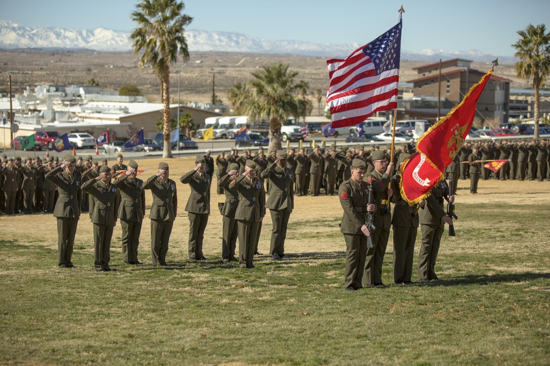 Marines with 2nd Battalion, 7th Marine Regiment salute the colors during the playing of the national anthem as part of the battalion’s 75th anniversary and battle colors rededication ceremony at Lance Cpl. Torrey L. Gray Field, Jan. 8, 2016. (Official Marine Corps photo by Lance Cpl. Levi Schultz/Released)