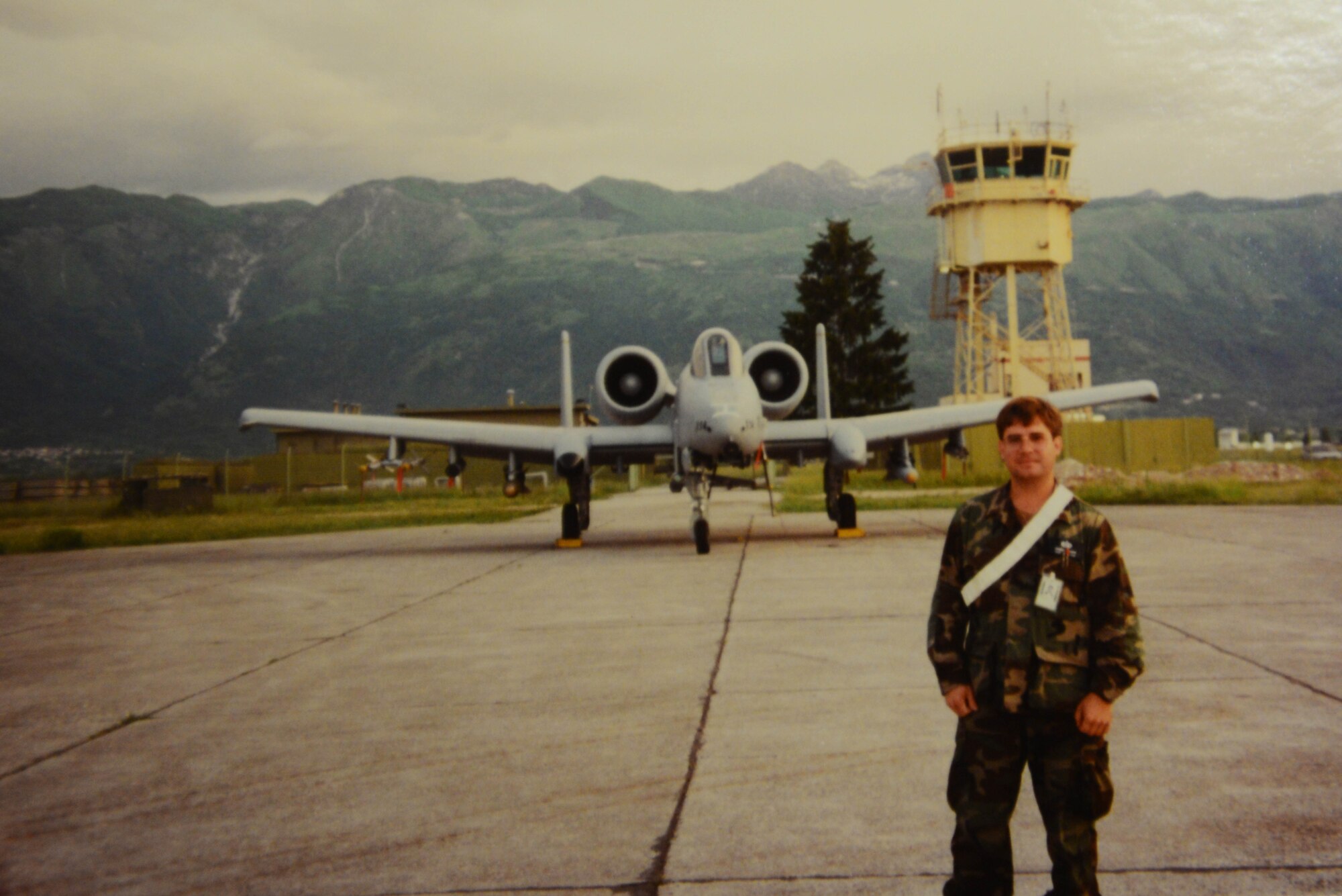 In 1995, Staff Sgt. Joseph Welebob poses for a photo on the flightline at Aviano Air Base, Italy. While deployed to Aviano, Welebob was involved with responding to an incident where an F-16 Fighting Falcon and its pilot was shot down behind enemy lines. (courtesy photo)