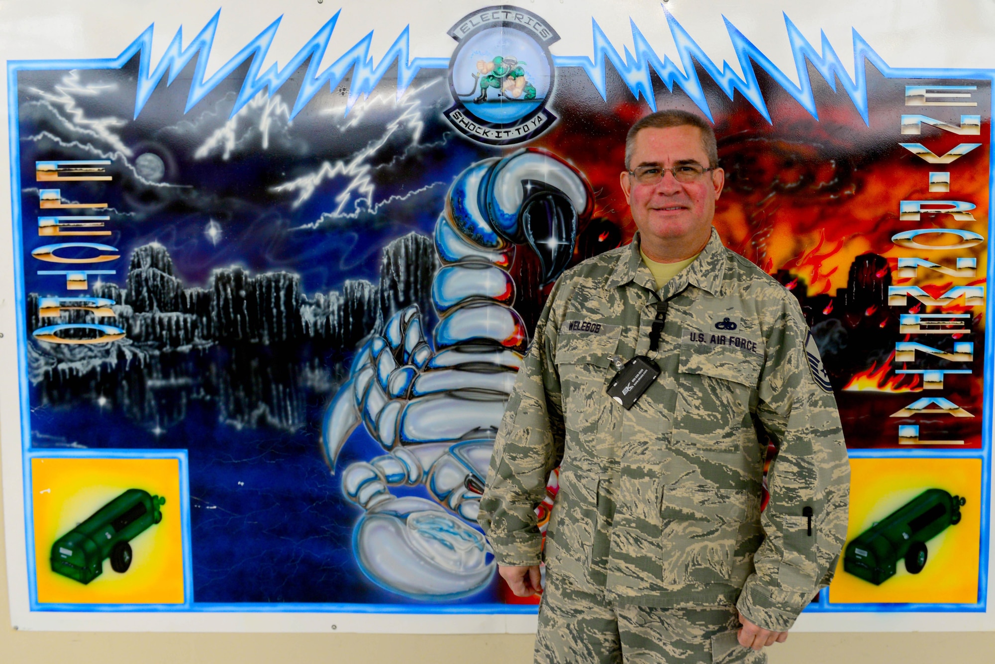 Master Sgt. Joseph Welebob, 707th Maintenance Squadron flight supervisor, poses for a photo in front of the 2nd Maintenance squadron electrical and environmental shop at Barksdale Air Force Base, La., Jan. 11, 2016. Welebob has worked with aircraft electrical systems for over 30 years. (U.S. Air Force photo/Airman 1st Class Luke Hill)