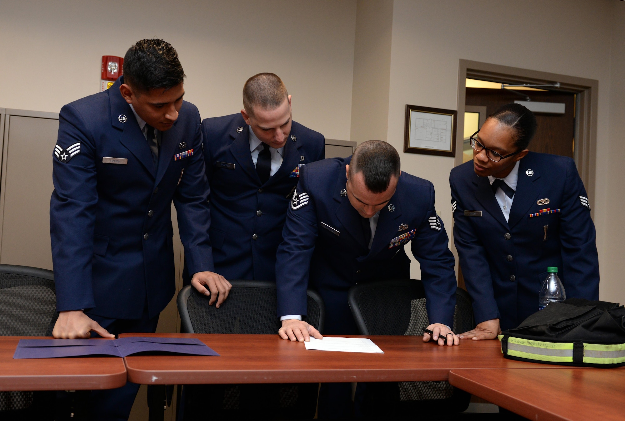 The 20th Aircraft Maintenance Unit Viper 3 load team works together to complete a general weapons knowledge test prior to the fourth quarter weapons load competition at Barksdale Air Force Base, La., Jan. 7, 2016. The Viper 3 crew competed against the best crew from the 96th Aircraft Maintenance Unit, Cobra 7. To become eligible to compete for the quarterly competition, monthly load stats were evaluated, along with flightline evaluations, semi-annual evaluations and stellar aircraft maintenance actions. (U.S. Air Force photo/Airman 1st Class Curt Beach) 