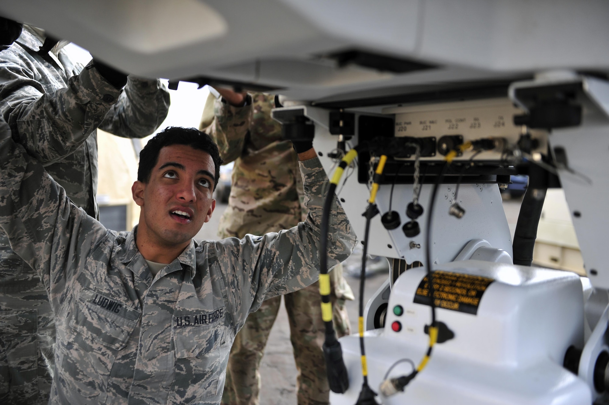 Airman 1st Class Sean Ludwig, radio frequency transmission apprentice with the 1st Special Operations Communications Squadron, installs satellite parts during exercise Frigid Archer 2016 at Eglin Range, Fla., Jan. 7, 2016. Frigid Archer tested 1st Special Operations Wing Air Commandos’ expertise through a myriad of operational and support requirements. (U.S. Air Force photo by Staff Sgt. Tyler Placie)