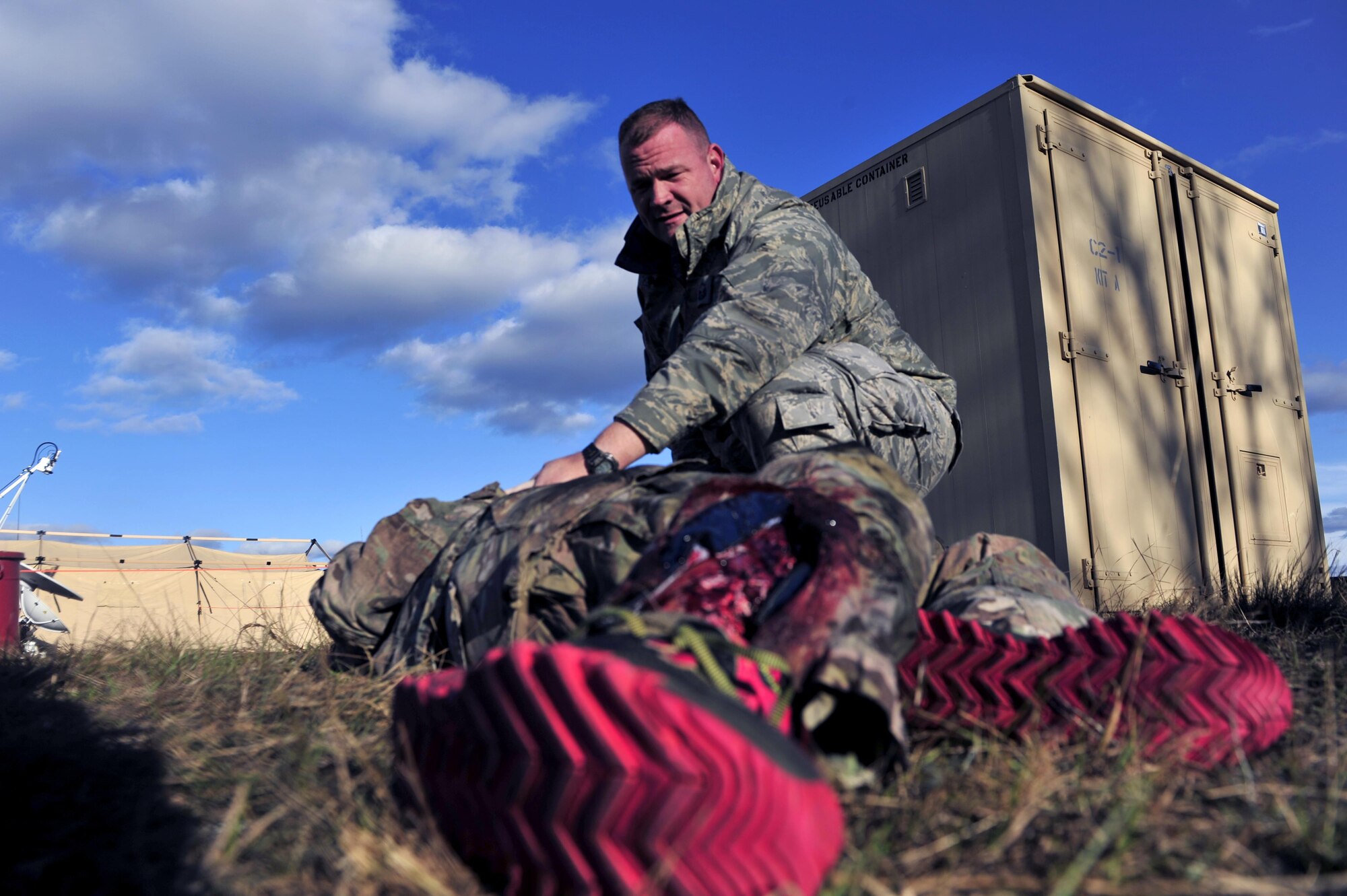 Master Sgt. Jason Evans, Tactical Flight Section Chief with the 1st Special Operations Communication Squadron, provides Self-Aide Buddy Care during exercise Frigid Archer 2016 at Eglin Range, Fla., Jan. 10, 2016. Frigid Archer tested 1st Special Operations Wing Air Commandos’ expertise through a myriad of operational and support requirements. (U.S. Air Force photo by Staff Sgt. Tyler Placie)