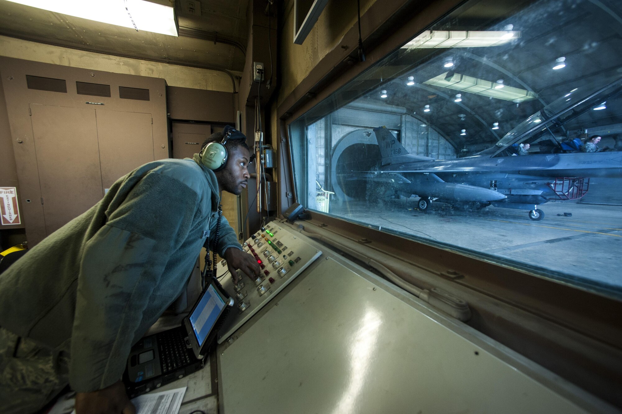 Tech. Sgt. Rowland Thagard, 8th Maintenance Squadron assistant propulsion section chief, oversees Airmen during an engine test in a hush house at Kunsan Air Base, Republic of Korea, Dec. 9, 2015. In addition to the hush house, the 8th MXS maintenance flight encompasses multiple duty sections, which include a tire shop, aerospace propulsion, crash damage, aircraft recovery and phase.  (U.S. Air Force photo by Staff Sgt. Nick Wilson/Released)