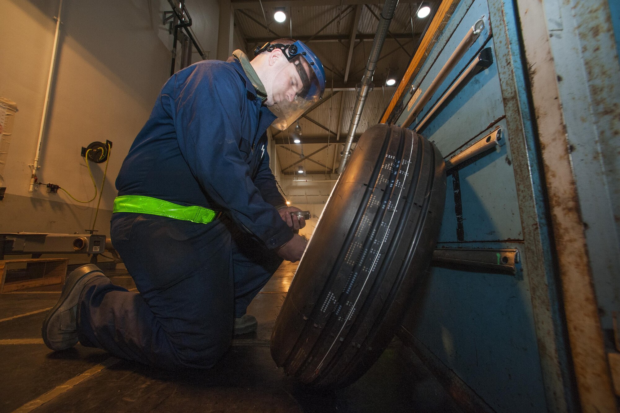 Senior Airman Matthew Ring, 8th Maintenance Squadron transient assistance crash recovery journeyman, signs a tag after performing a leak check on an F-16 Fighting Falcon landing gear tire at Kunsan Air Base, Republic of Korea, Jan. 7, 2016. In the tire shop, one of Ring’s responsibilities is to ensure that he gets tires from the aircraft maintenance units, break them down, rebuild them and get them returned as soon as possible. (U.S. Air Force photo by Staff Sgt. Nick Wilson/Released)