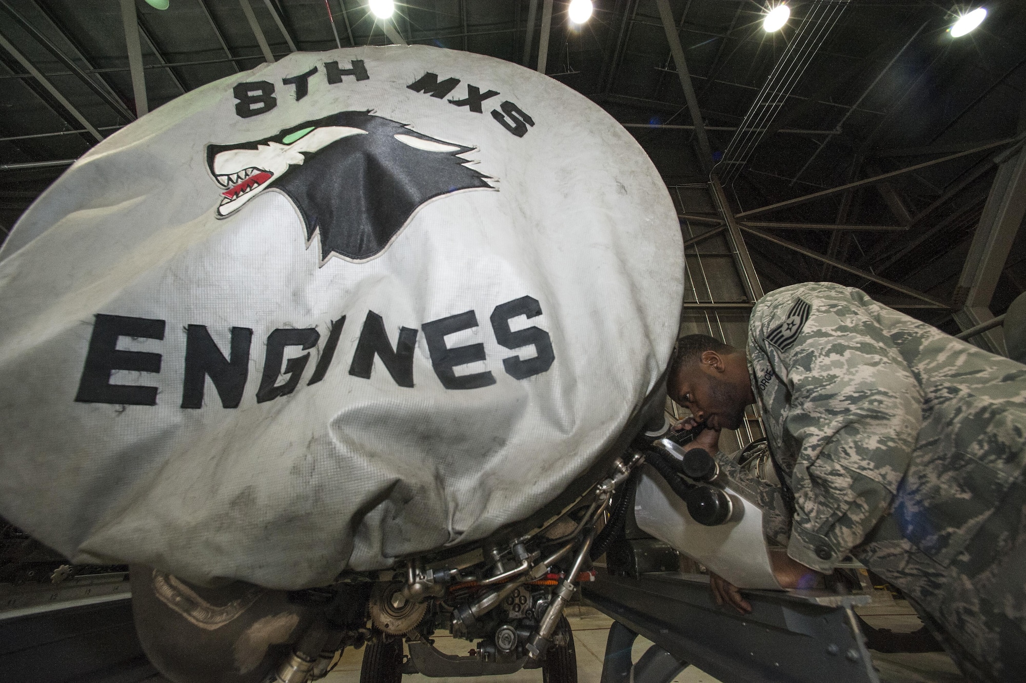 Tech. Sgt. Rowland Thagard, 8th Maintenance Squadron assistant propulsion section chief, performs an inspection on the outer components of an F-16 Fighting Falcon engine at Kunsan Air Base, Republic of Korea, Jan. 7, 2016. The propulsion section controls and maintains all of the inbound and outbound F-16 Fighting Falcon engines on base. (U.S. Air Force photo by Staff Sgt. Nick Wilson/Released)