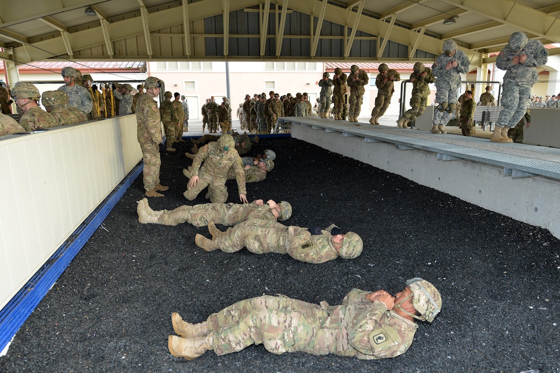 U.S. paratroopers rehearse parachute landing falls at Aviano Air Base, Italy, before participating in airborne operations on the Juliet drop zone in Pordenone, Italy, Jan. 8, 2016. The paratroopers are assigned to the 173rd Brigade Support Battalion. U.S. Army photo by Massimo Bovo