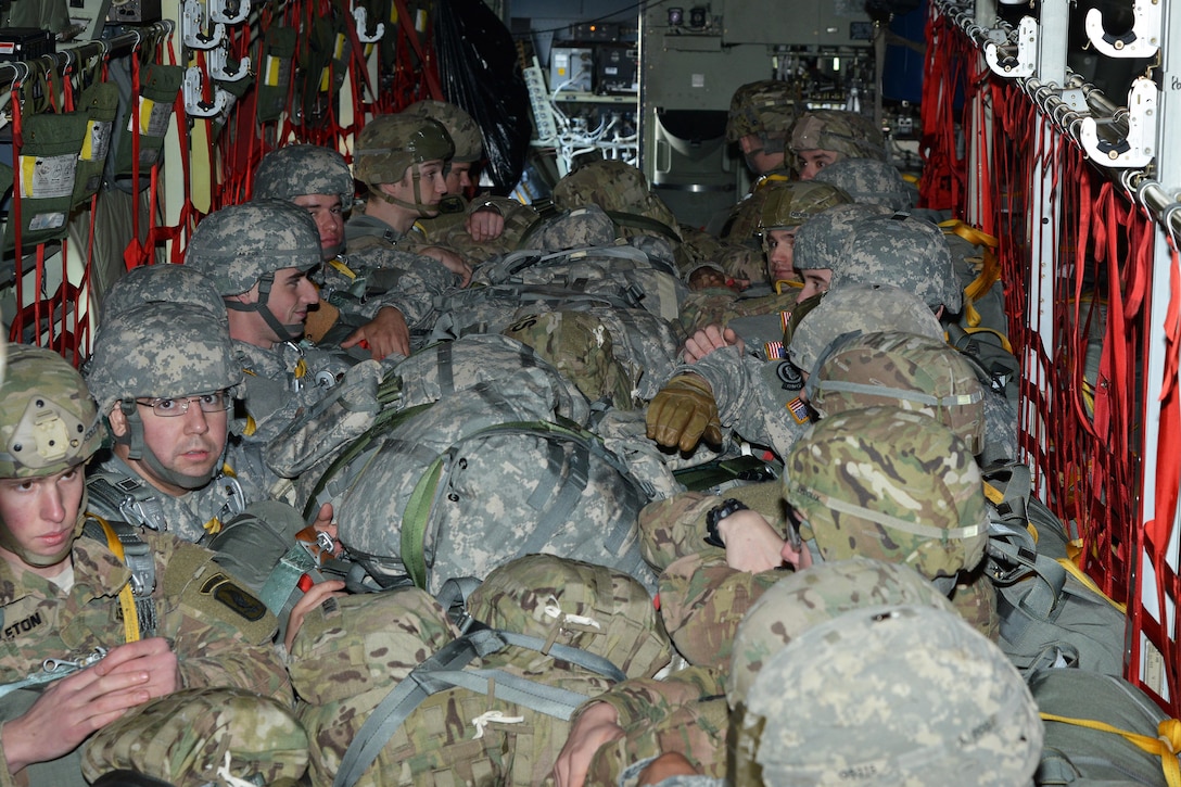U.S. paratroopers sit and wait for takeoff after boarding a U.S. Air Force C-130 Hercules on Aviano Air Base, Italy, Jan. 8, 2016. U.S. Army photo by Massimo Bovo