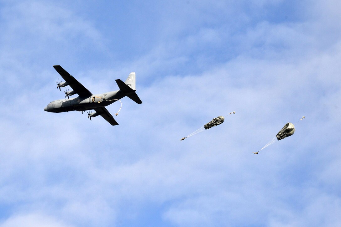 U.S. paratroopers exit a U.S. Air Force C-130 Hercules during airborne operations over the Juliet drop zone in Pordenone, Italy, Jan. 8, 2016. U.S. Army photo by Massimo Bovo