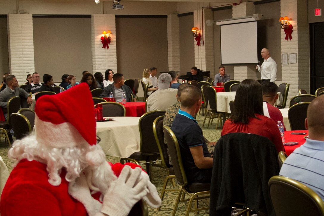 The Commanding Officer of the 11th Marine Expeditionary Unit (11th MEU), Col. Clay Tipton, speaks to Marines and their families about what the 11th MEU is and what its training workup cycle will look like for the upcoming Western Pacific Deployment 16-2. During the party, the Marines and families of the 11th MEU took the opportunity to break-bread and build camaraderie before taking leave for the holidays.