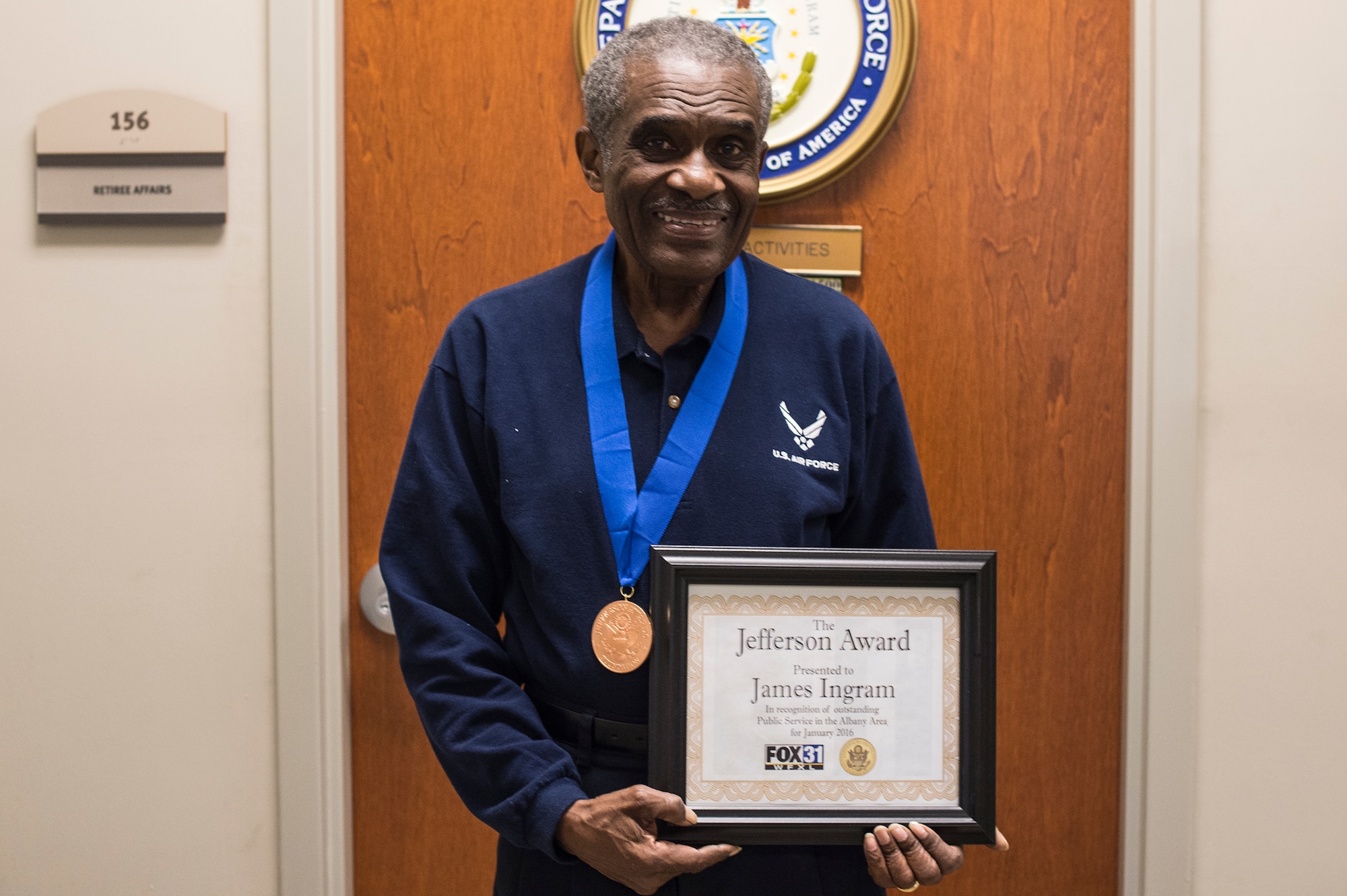 Retired U.S. Air Force Chief Master Sgt. James Ingram, 23d Wing retiree activities office director, poses for a photo with his Jefferson Award medal and certificate, Jan. 12, 2016, at Moody Air Force Base, Ga. Ingram is slated to attend the local awards banquet in February, where he will be formally honored for his achievements along with the 11 other winners. During this banquet, one local winner will be chosen to be recognized on the national level in Washington, D.C. (U.S. Air Force photo by Senior Airman Ceaira Tinsley/Released)