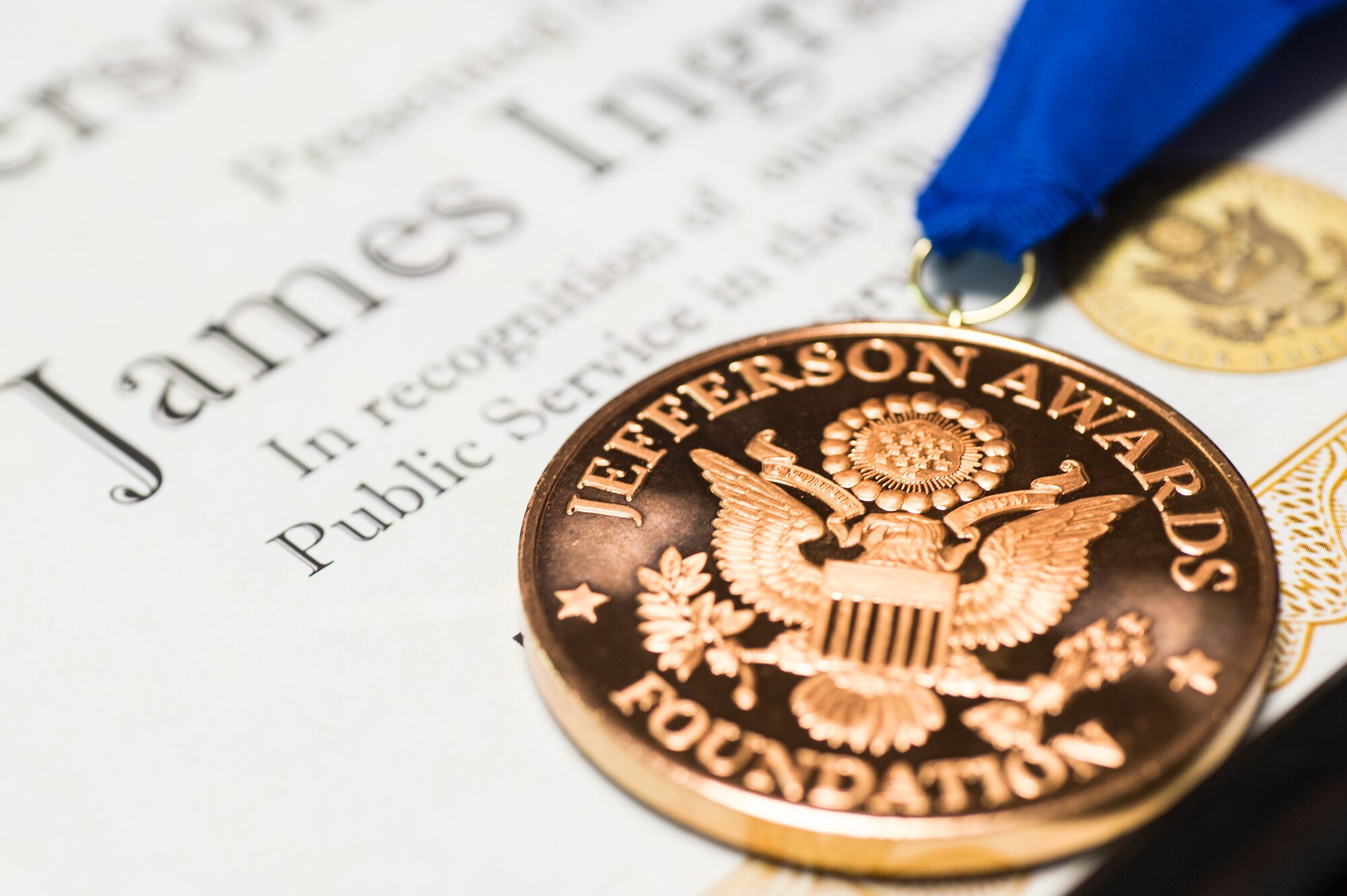 A Jefferson Award medal and certificate rest on a table, Jan. 12, 2016, at Moody Air Force Base, Ga. The Jefferson Award recognizes the achievements of leaders in the community for their outstanding public service. (U.S. Air Force photo by Senior Airman Ceaira Tinsley/Released)