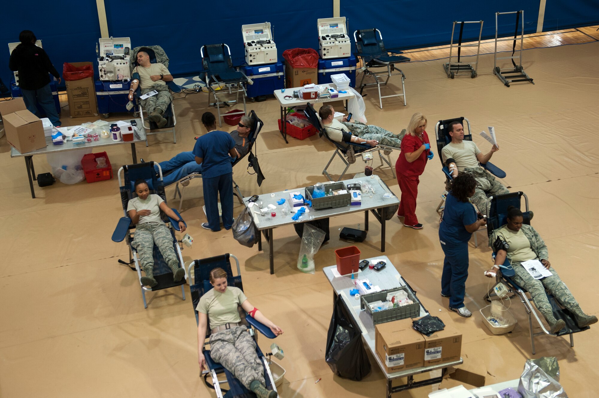 U.S. Air Force Airmen donate blood, Jan. 13, 2016, at Moody Air Force Base, Ga. The 23d Medical Group and American Red Cross exceeded their goal of collecting 45 units of blood by collecting 51 units throughout the day. (U.S. Air Force photo by Airman 1st Class Kathleen D. Bryant/Released)
