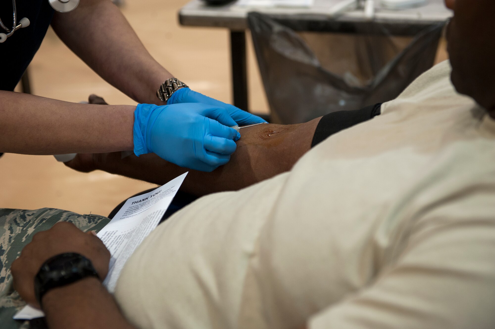 An American Red Cross phlebotomist prepares to draw blood from a donor, Jan. 13, 2016, at Moody Air Force Base, Ga. The donation process takes approximately 10 minutes for blood and up to 30 minutes for platelets. (U.S. Air Force photo by Airman 1st Class Kathleen D. Bryant/Released)
