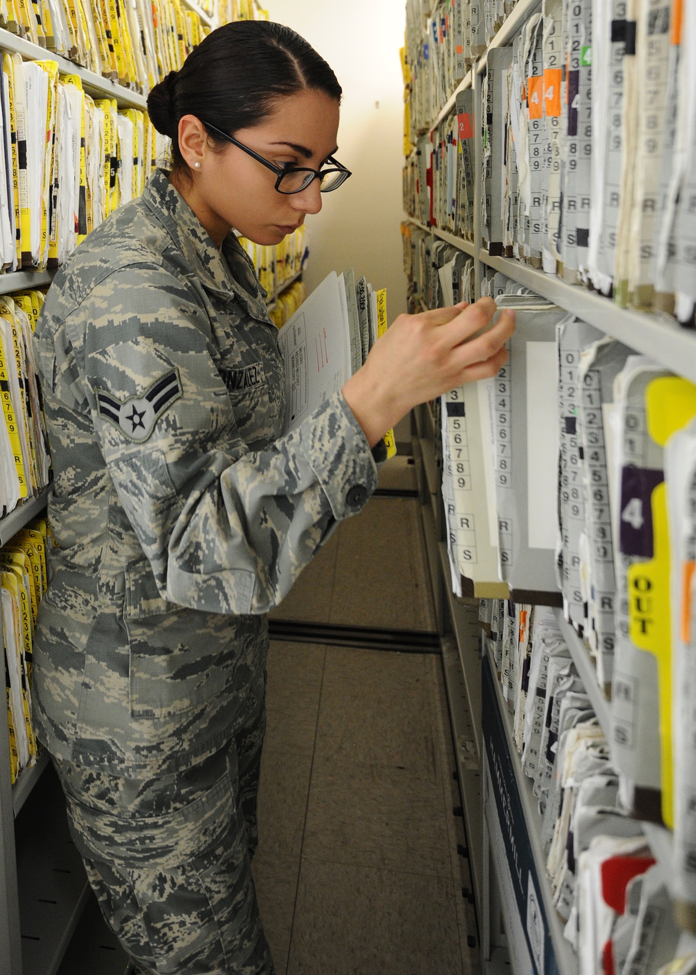 Airman 1st Class Gabriela Gonzalez, 325th Medical Support Squadron health service management apprentice, files a patient’s records at the health service management office Jan. 7. Patient’s records are comprised of uniformed services members, civilian dependents, and retired beneficiaries. The 325th MDSS is responsible for all human resource assets assigned to the 325th Medical Group. (U.S. Air Force photo by Senior Airman Ty-Rico Lea/Released)