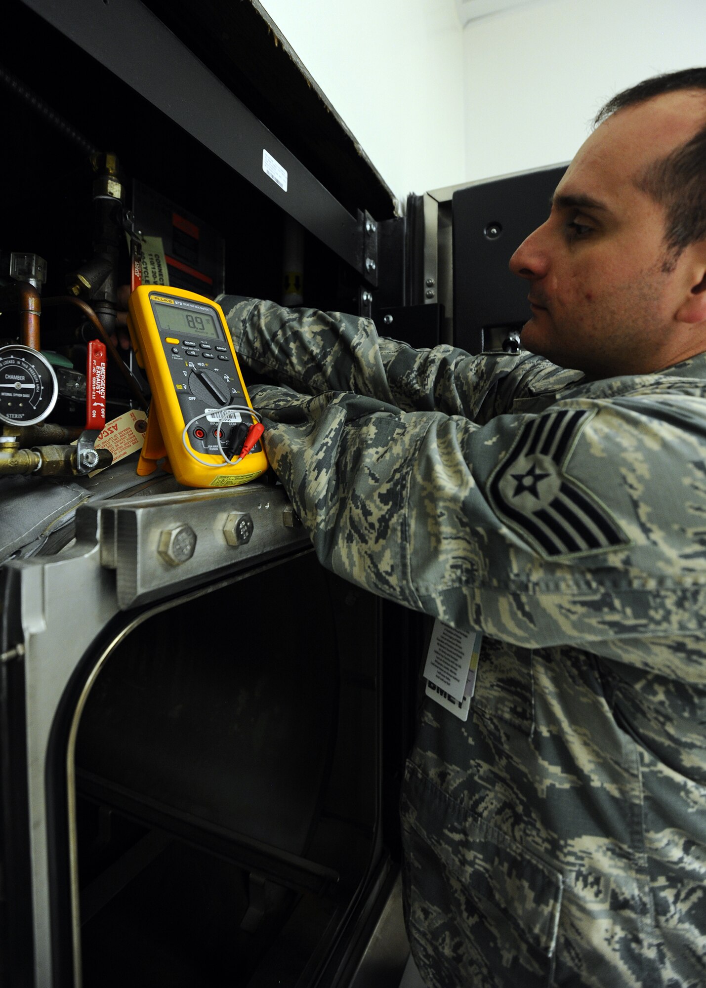 Staff Sgt. Danny Papageorgiou, 325th Medical Support Squadron biomedical equipment technician, monitors the electrical output of a steam sterilizer’s control board at the 325th Medical Group pharmacy Jan. 7. The steam sterilizer is used to clean medical supplies using immense heat to kill bacteria. Biomedical technicians are responsible for the maintenance and upkeep all medical facility equipment to include all 325th Medical Group campus assets. (U.S. Air Force photo by Senior Airman Ty-Rico Lea/Released)